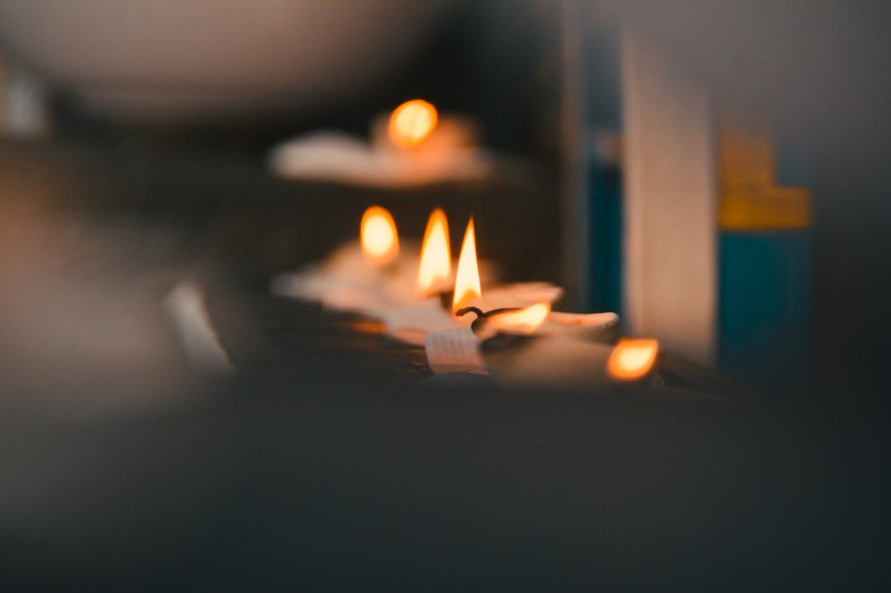 Photo by Thilipen Rave Kumar: https://www.pexels.com/photo/selective-focus-photography-of-lighted-tealights-1686020/