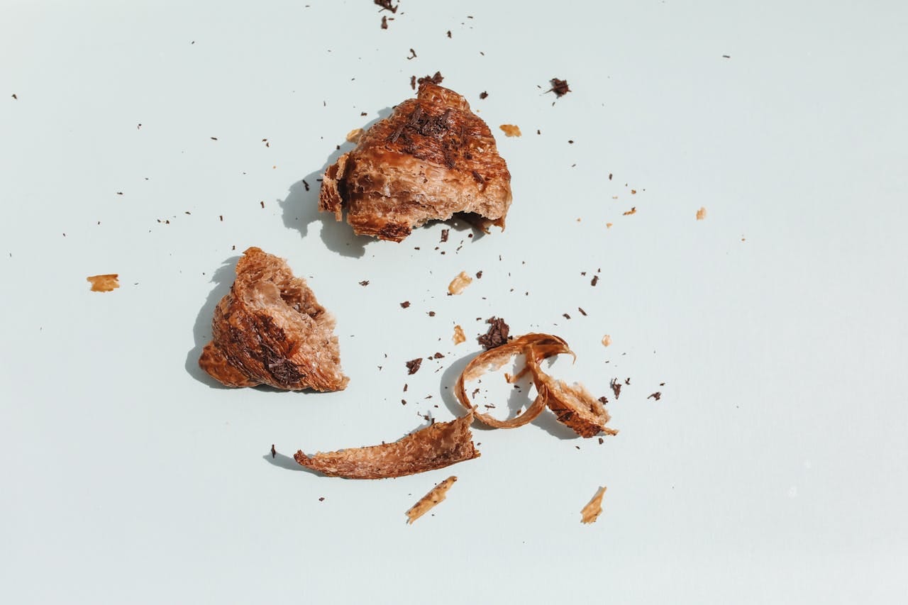 Photo by Polina Tankilevitch: https://www.pexels.com/photo/overhead-shot-of-a-broken-croissant-4828369/