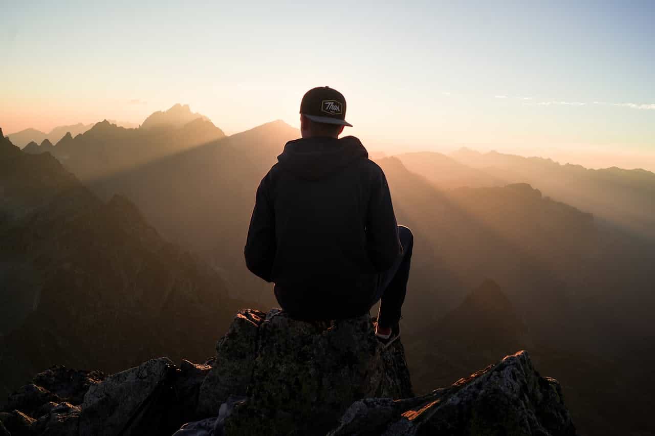 Photo by Stefan Stefancik: https://www.pexels.com/photo/man-sitting-on-the-mountain-edge-91224/